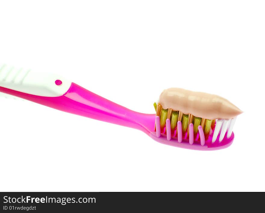 Toothbrush with paste isolated on white