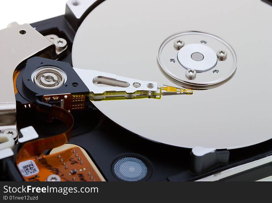 Close-up inside view of  hard disk isolated on white background