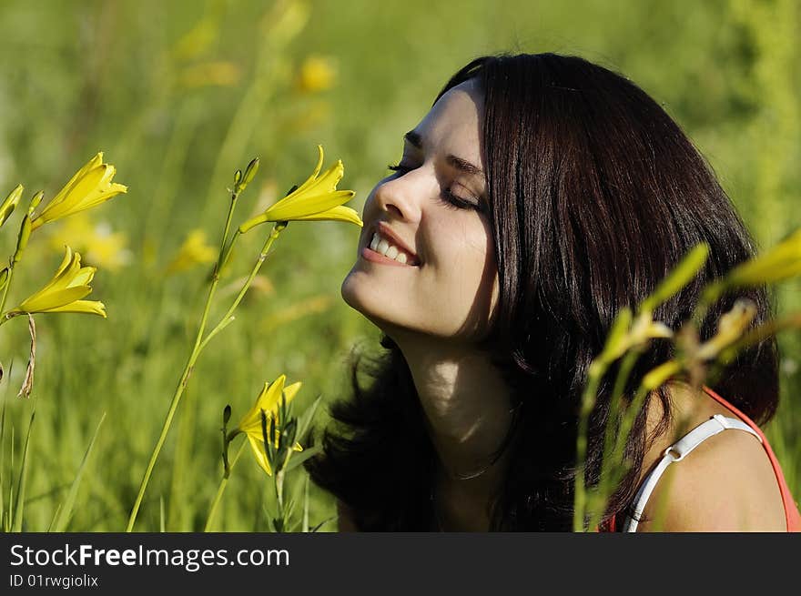 The woman covers the face from the sun. The woman covers the face from the sun