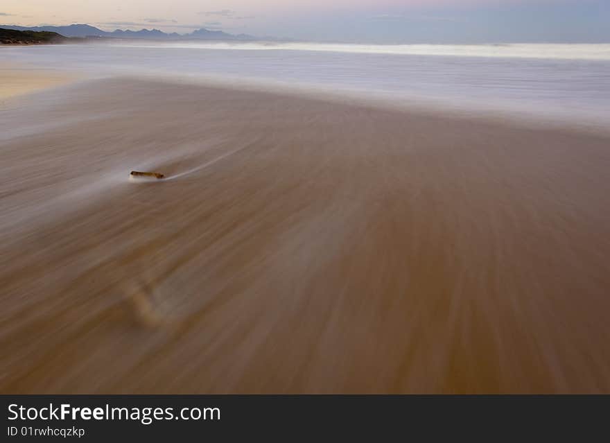 Huge wave overflows the sandbank at the Hartenbos river mouth. Huge wave overflows the sandbank at the Hartenbos river mouth