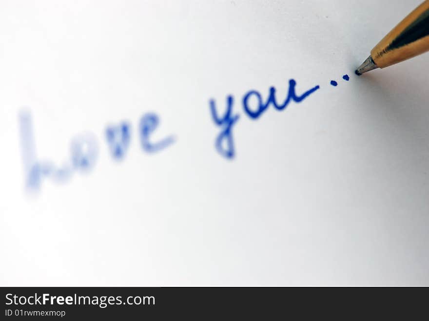 Pen writing  Love you on the paper. Pen writing  Love you on the paper