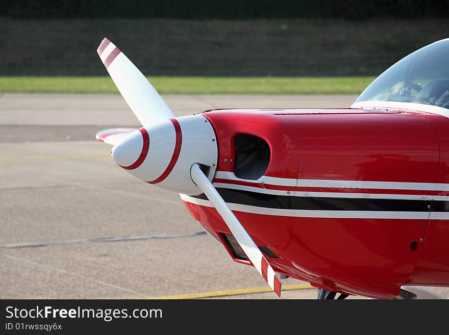 Propeller of a red small Sportsplane. Propeller of a red small Sportsplane