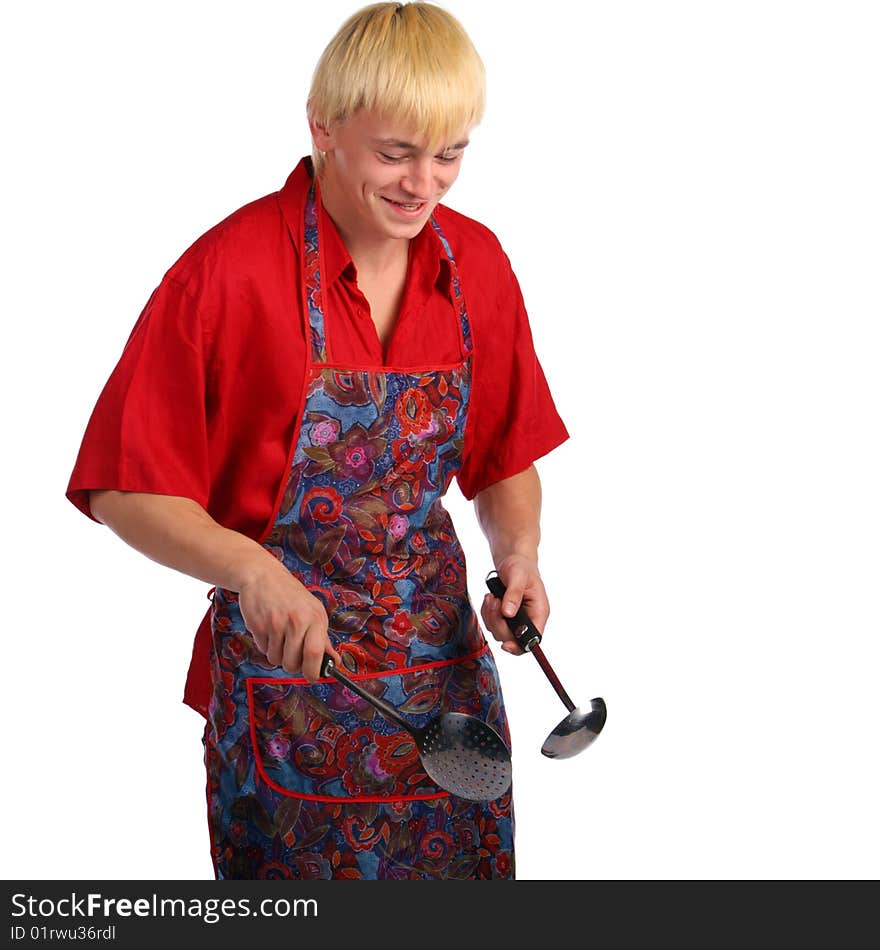 Young man in apron with cook tools. Isolated.