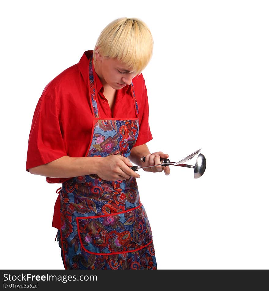 Young man in apron with cook tools. Isolated.