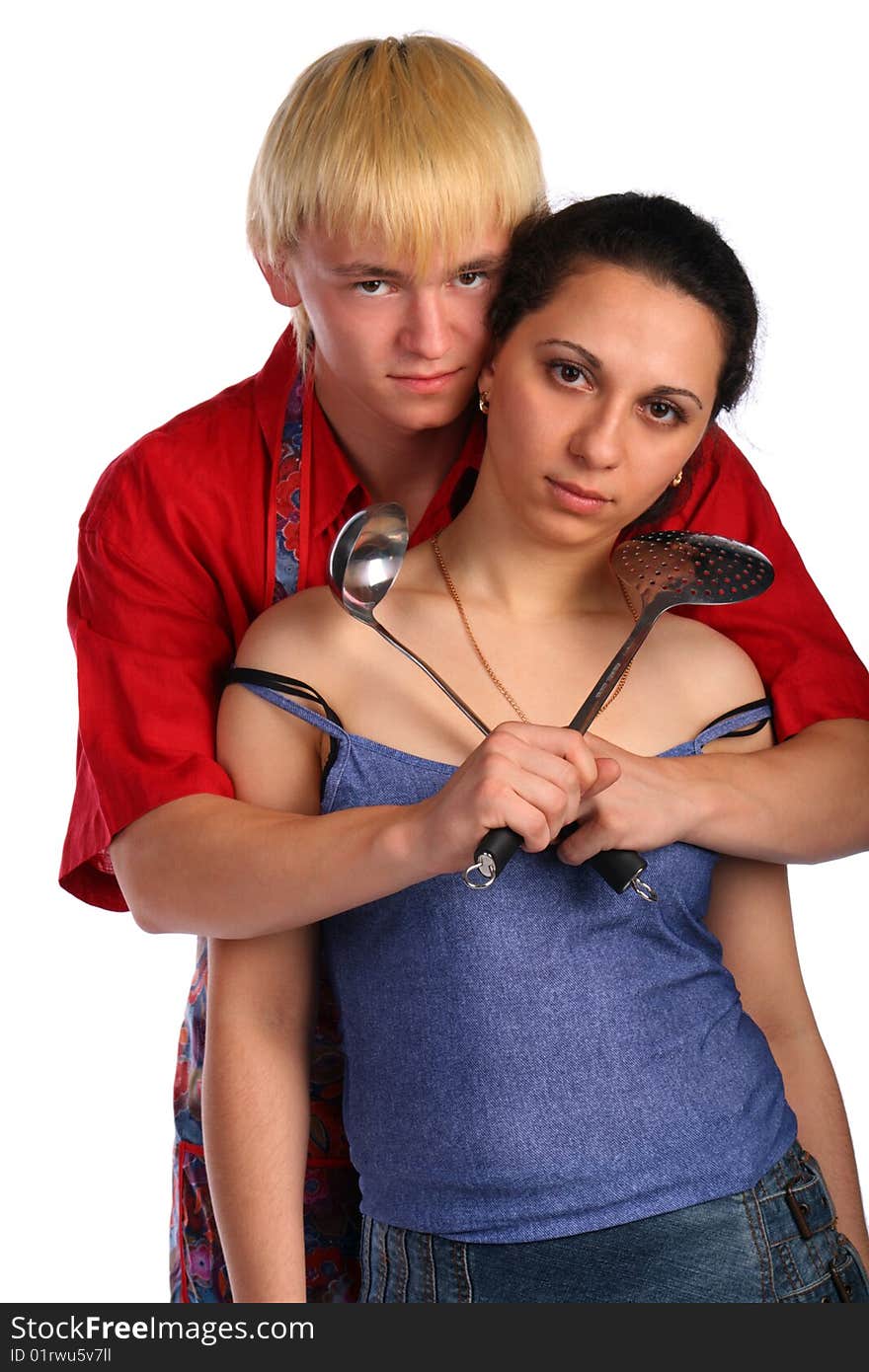 Young man and woman embraces with utensil. Isolated.