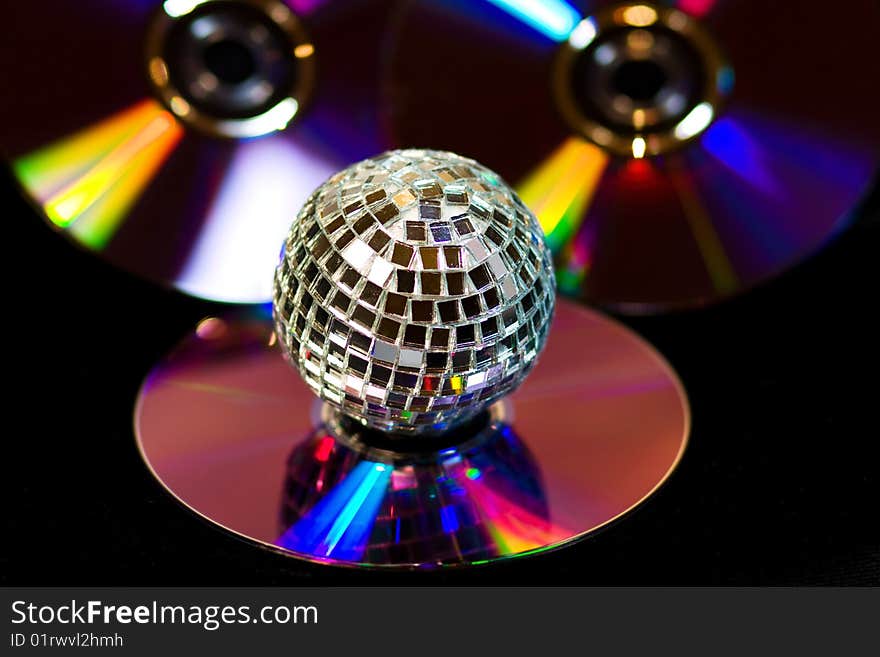 Disco ball with music DVDS on black