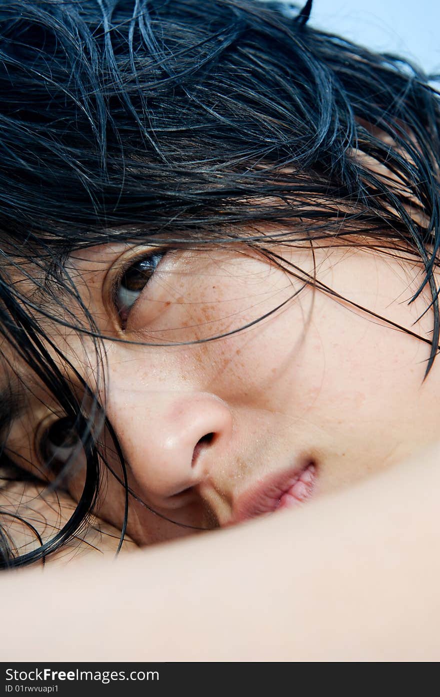 Asian girl with wet hair relaxing