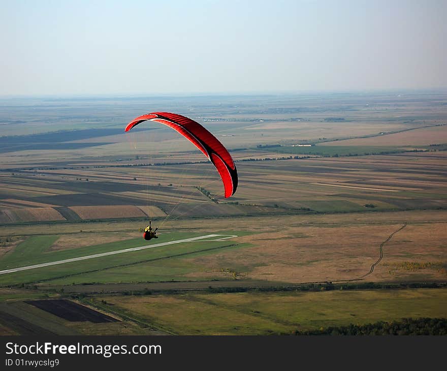 Paraglider flying in the sky