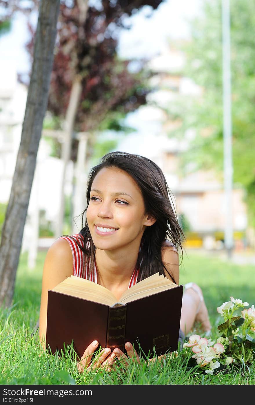 Young Woman In Green Park, Book And Reading