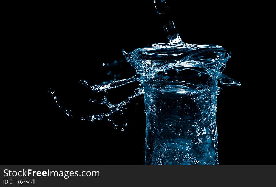 Blue water splash on a black background