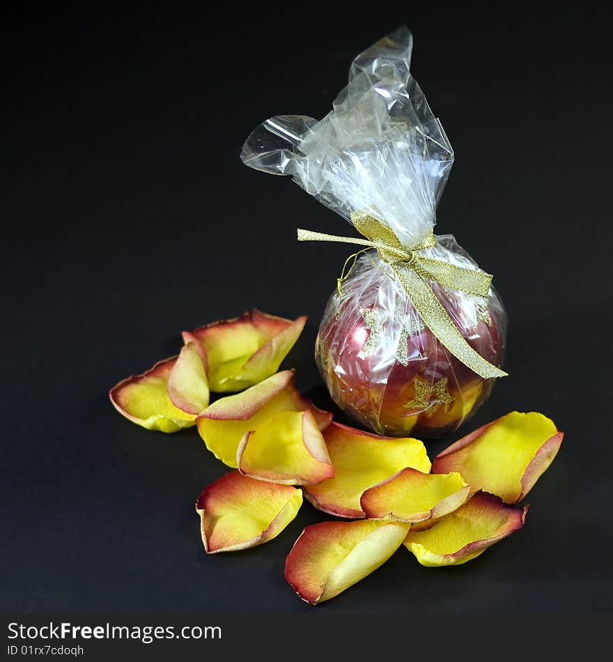 Petals of a yellow-red rose near the ball. Petals of a yellow-red rose near the ball