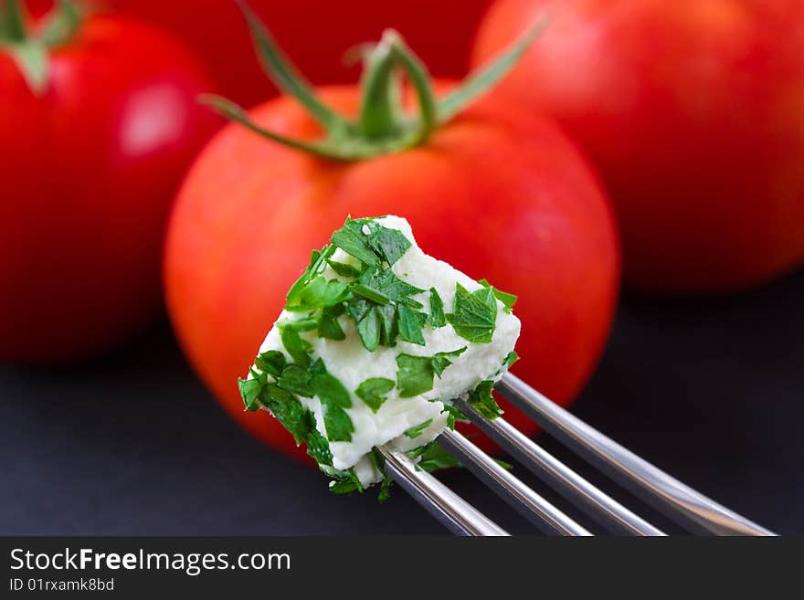 Cheese cube and tomatos