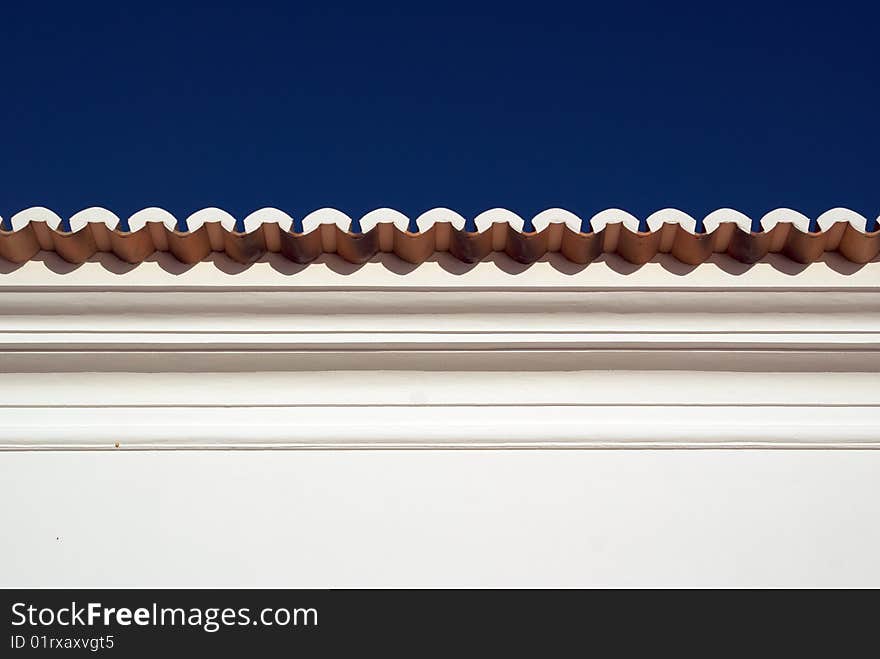 A traditional roofline of a house in Algarve. A traditional roofline of a house in Algarve