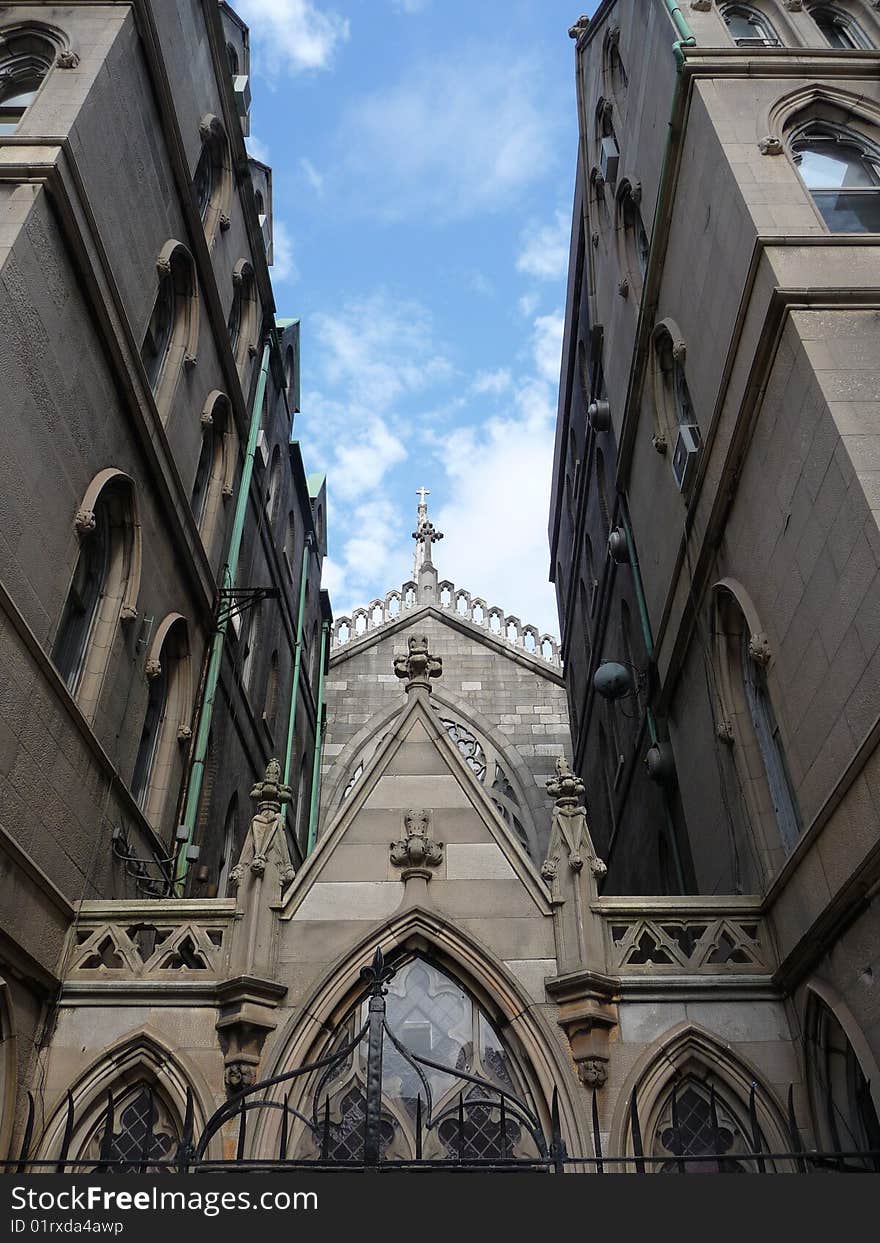 Looking up at a blue sky through Grace Church in manhattan