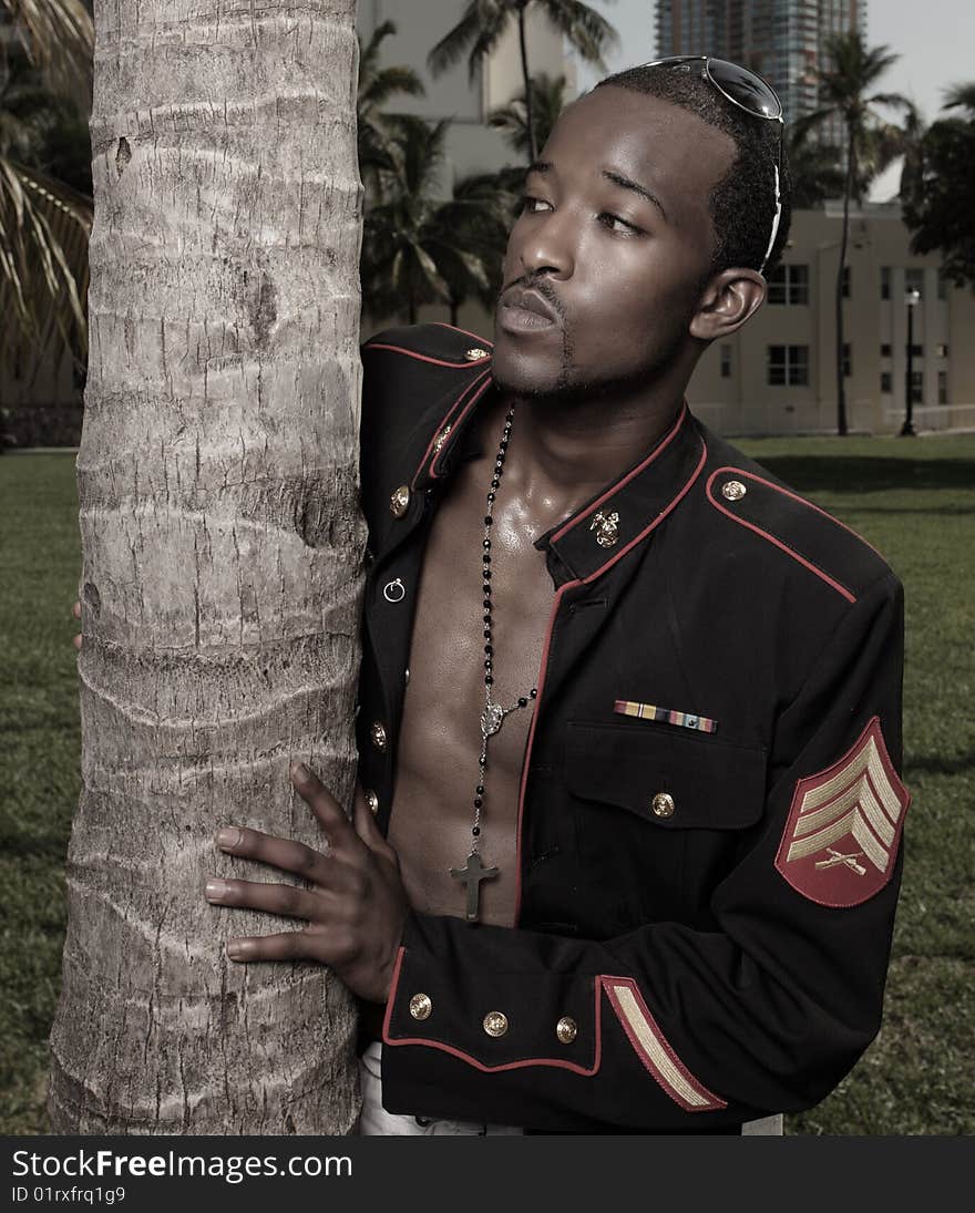 Man posing in a military jacket. Man posing in a military jacket