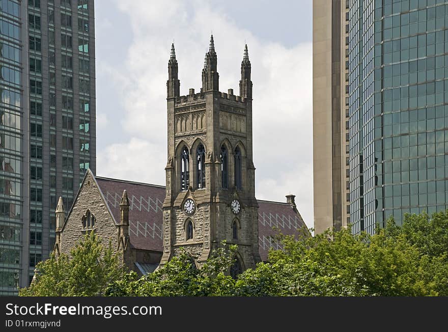 Old church between skyscrapers