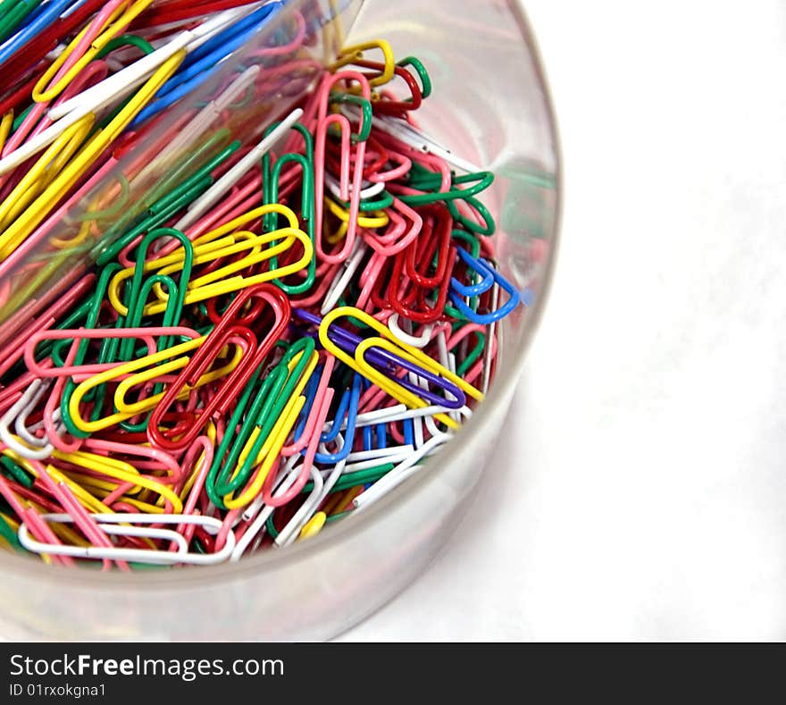 Clear Cup Of Colored Paperclips