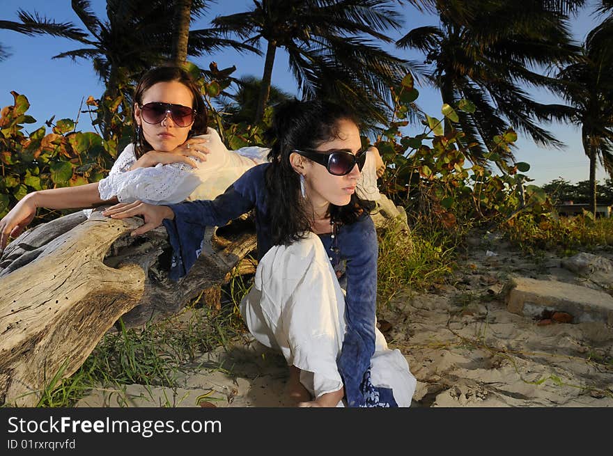 Portrait of two fashion female models on tropical beach. Portrait of two fashion female models on tropical beach