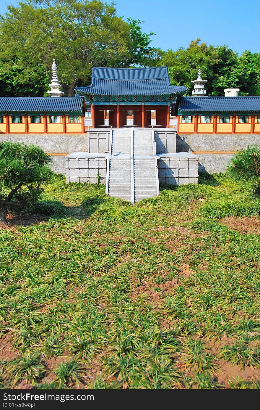 Front view of temple architecture surrounded with nature