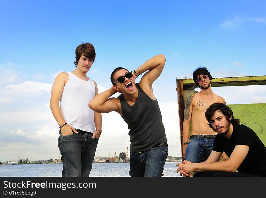 Portrait of cool team of young friends posing outdoors. Portrait of cool team of young friends posing outdoors