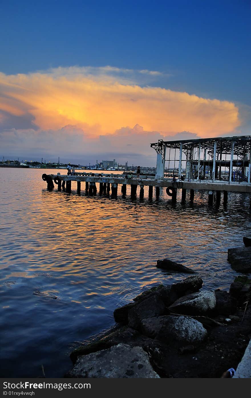 Abandoned pier at sunset