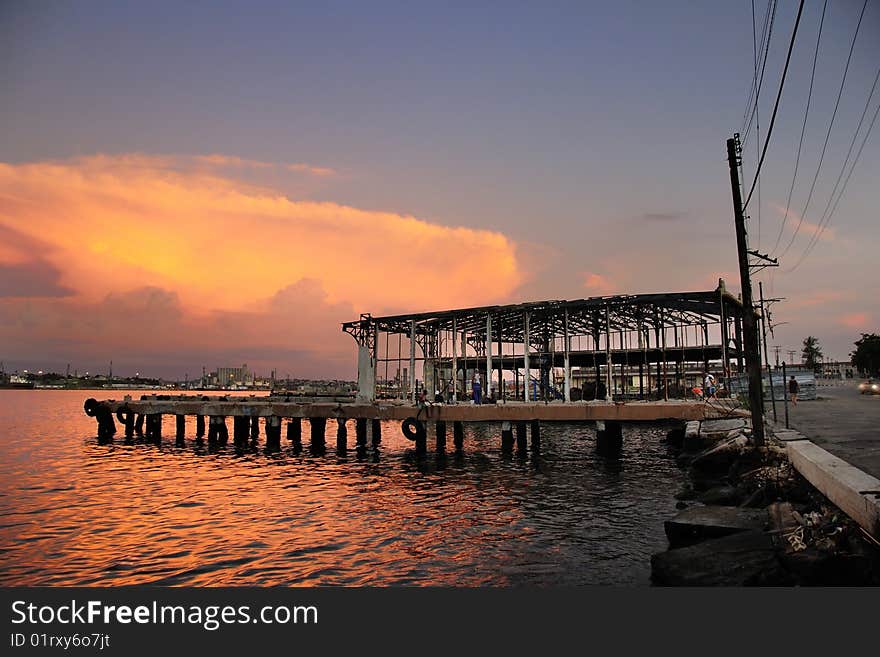 Abandoned pier at sunset