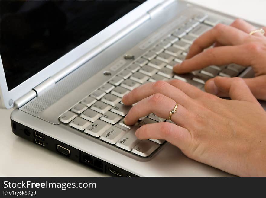 Closeup of a hands typing on the keyboard