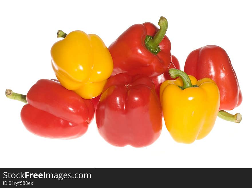 Red and yellow peppers on white background