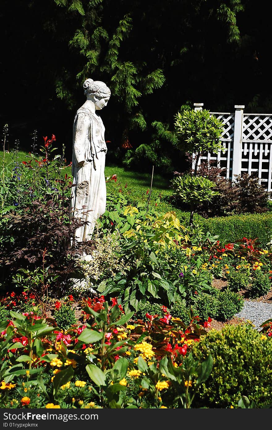 Green garden statue in park setting