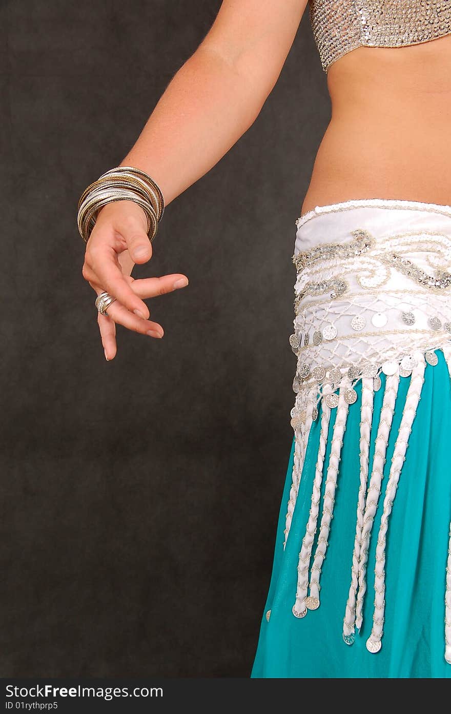 Belly-dancer in traditional turquoise blue attire. Belly-dancer in traditional turquoise blue attire