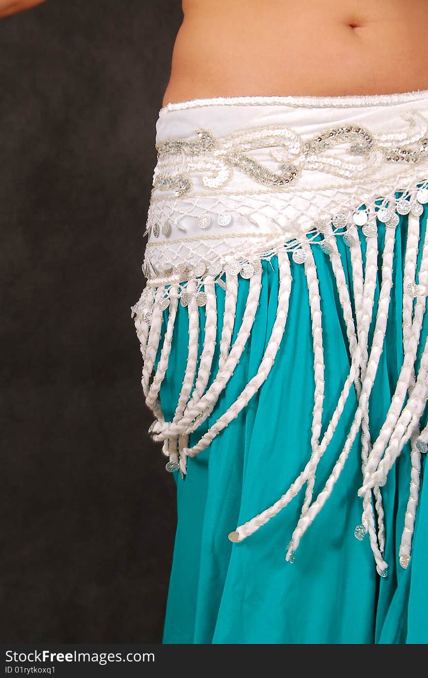 Belly-dancer in traditional turquoise blue attire. Belly-dancer in traditional turquoise blue attire