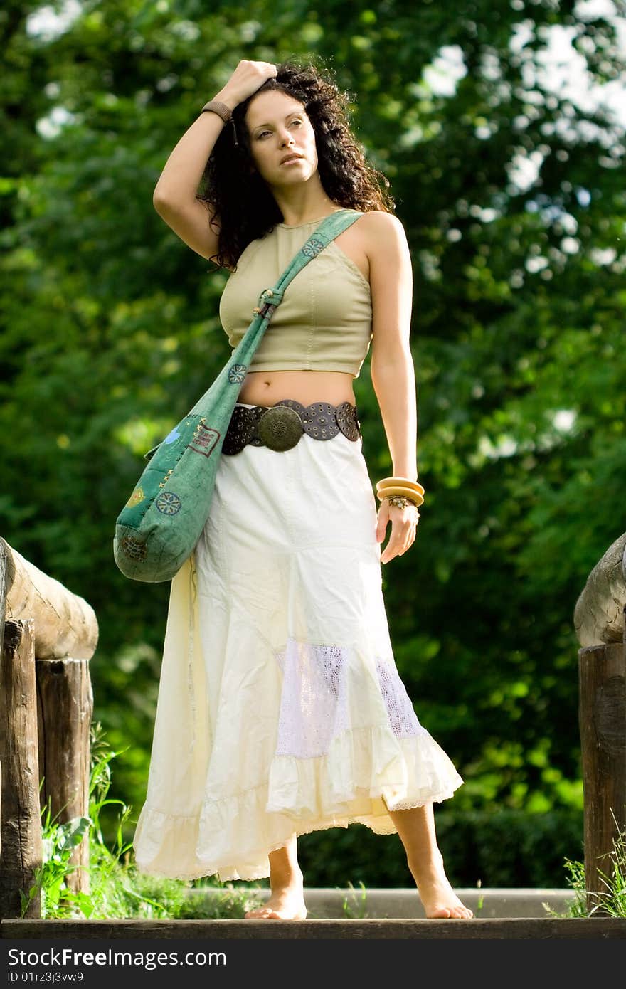 Portrait of a beautiful woman standing in the park