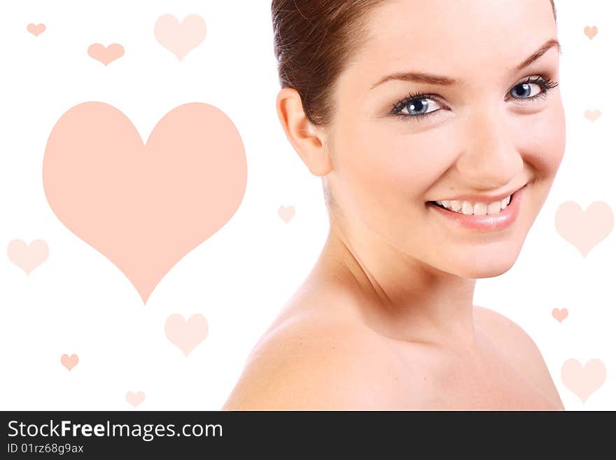 A beautiful confident woman smiling at the camera in front of a white background.