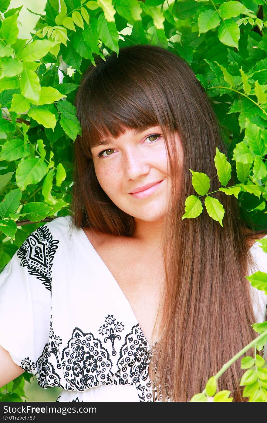 Portrait of attractive girl on natural background