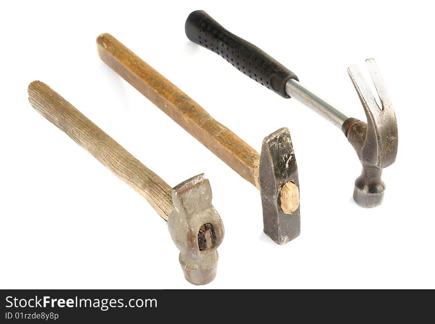 Three old hammers isolated on white background. Three old hammers isolated on white background.