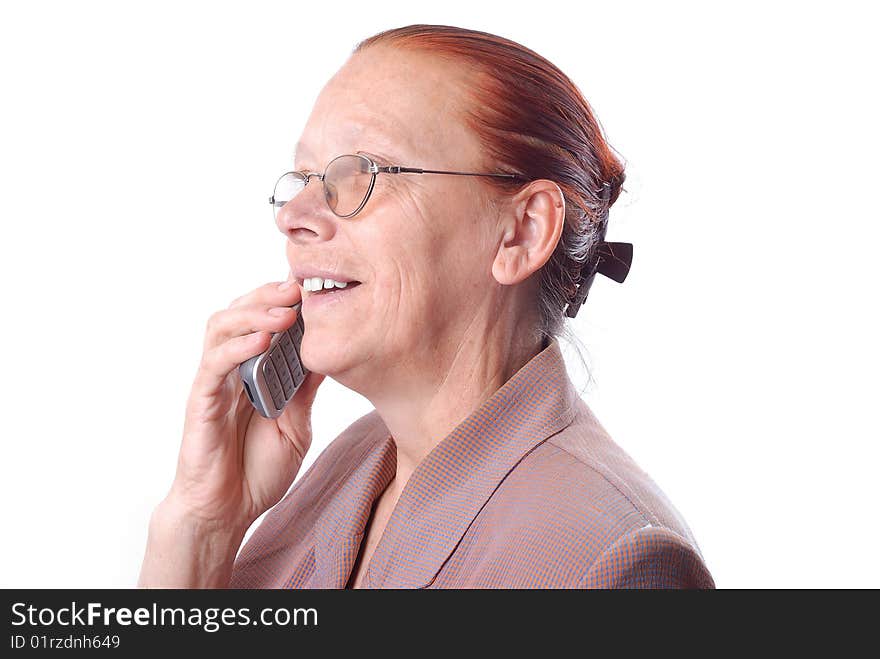 Middle aged woman is speaking on phone. Middle aged woman is speaking on phone