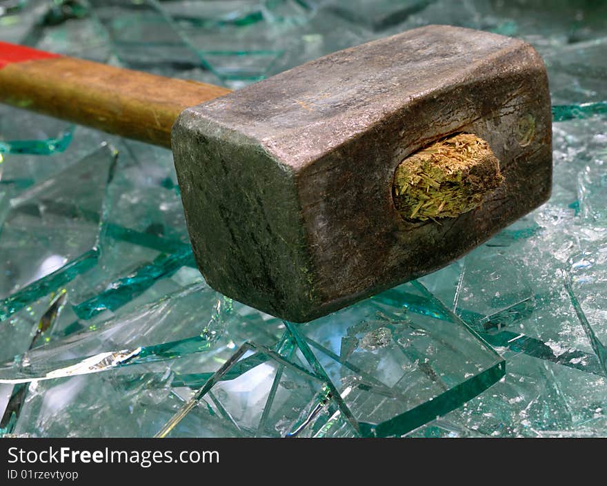 Sledge hammer and broken glass.