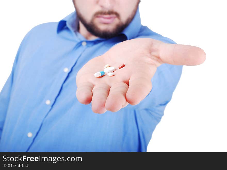 Man is offering medical pills on his palm. Man is offering medical pills on his palm