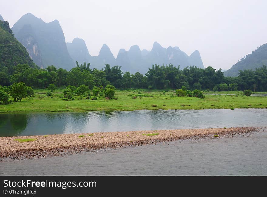 Mountains,bamboo,green grassland,river and sand. Mountains,bamboo,green grassland,river and sand.