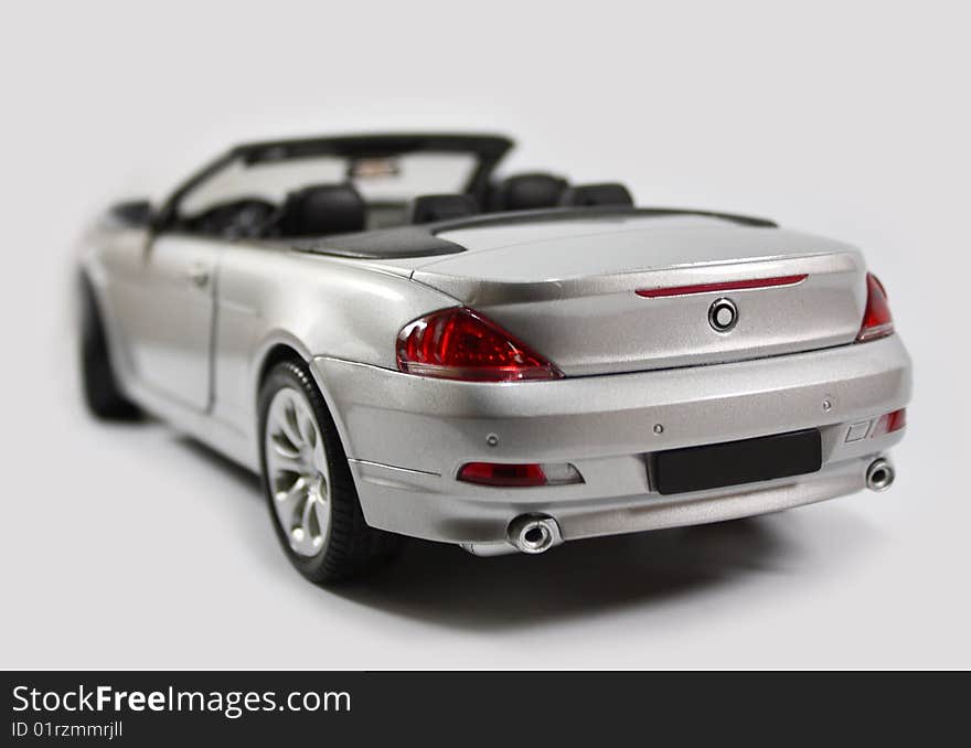 Silver convertible sports model car. Silver convertible sports model car