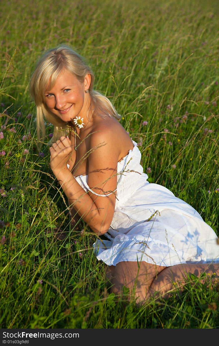 Young  woman lying in grass