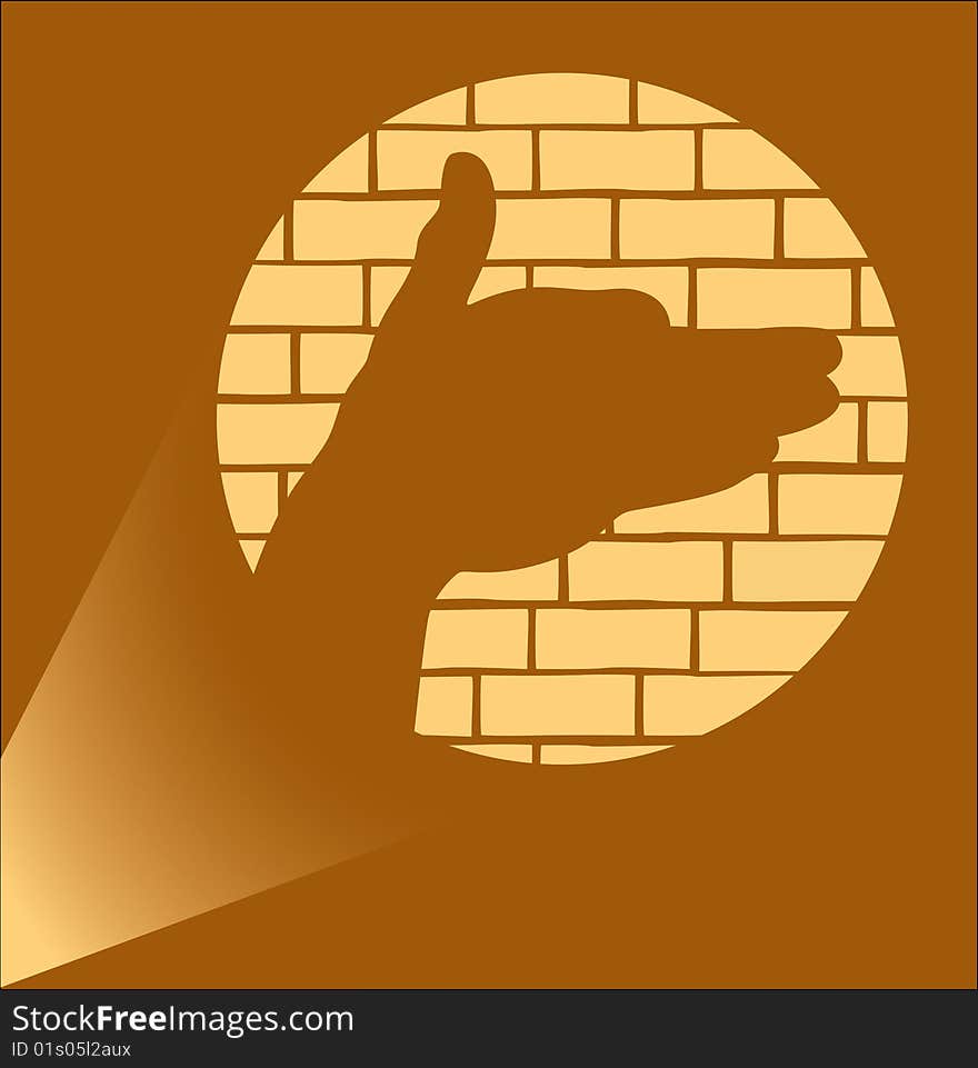 Silhouette similar to a head of the animal, received by displaying of the shined brush of a hand on a wall.