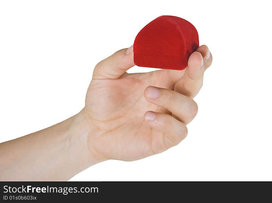 Man's hand holding small red box with gift