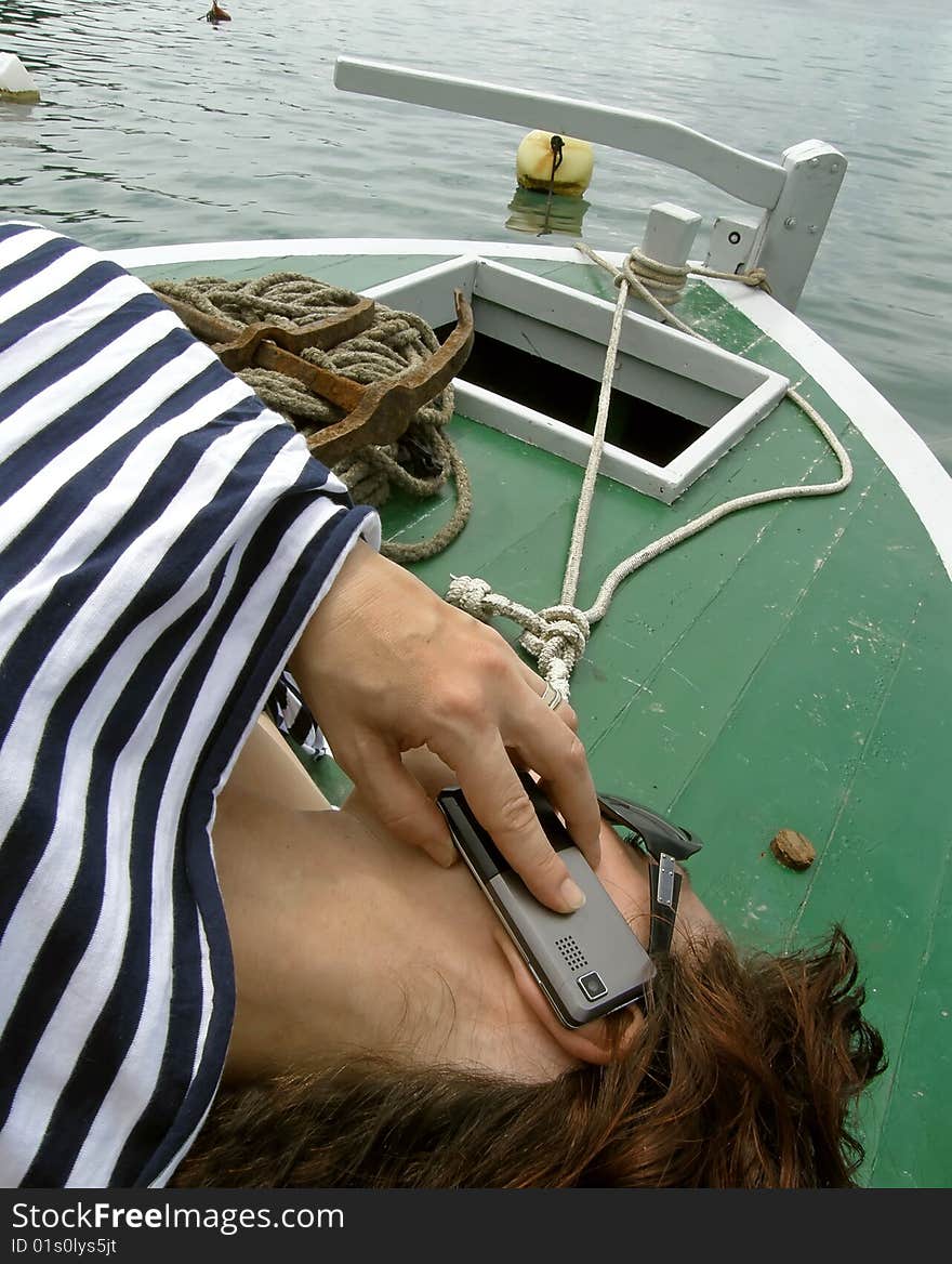 Woman chat on boat in marine dress. Woman chat on boat in marine dress