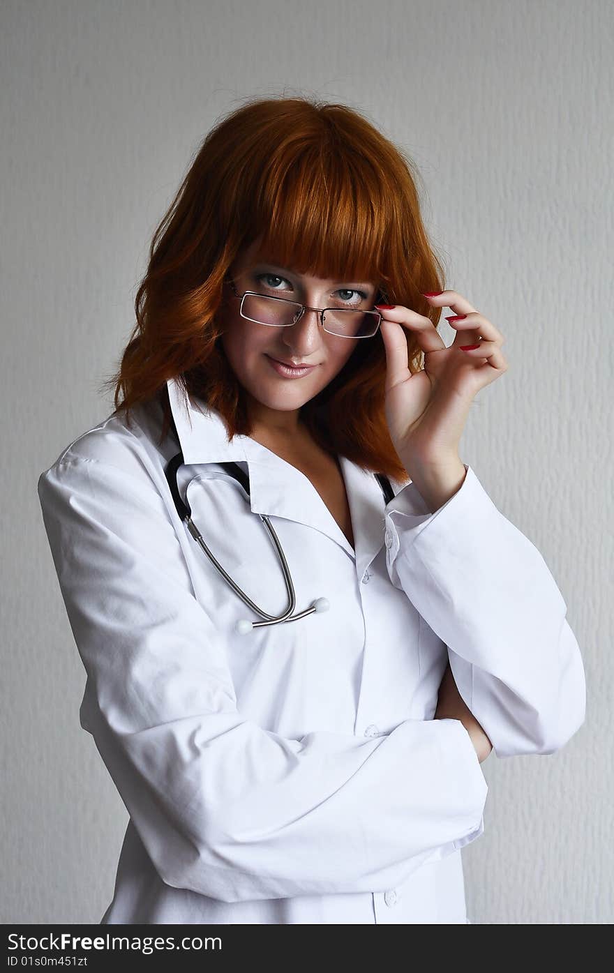 Female doctor looking through glasses