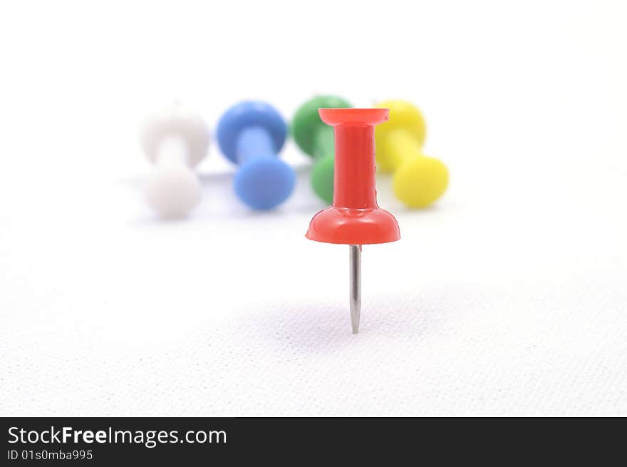 A set of color pins on white background. A set of color pins on white background