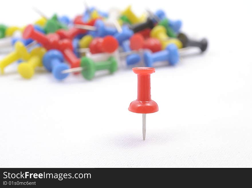 A set of color pins on white background. A set of color pins on white background