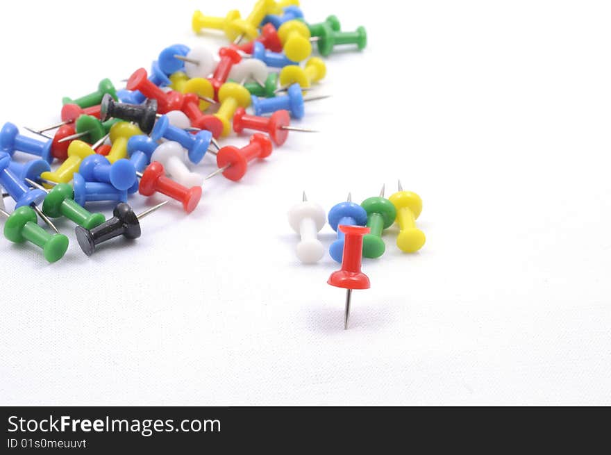 A set of color pins on white background. A set of color pins on white background