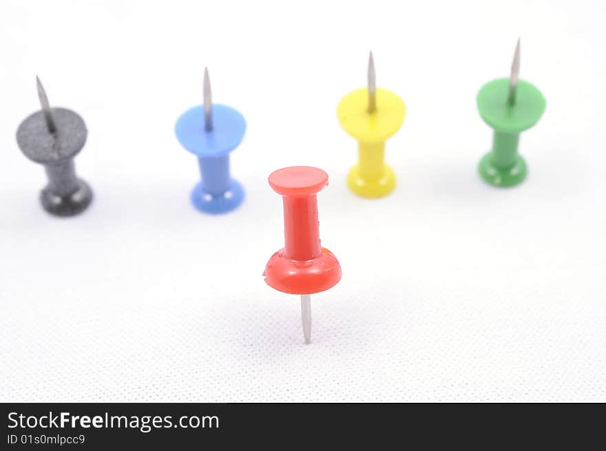 A set of color pins on white background. A set of color pins on white background