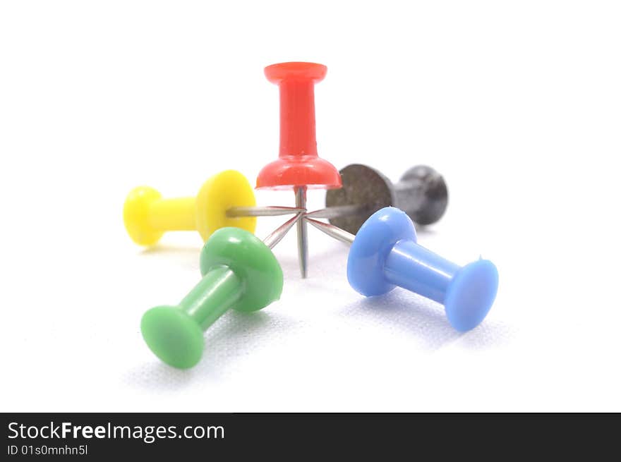 A set of color pins on white background. A set of color pins on white background